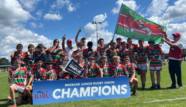 Redlands Rugby Union Club A junior rugby team in red, green, and white uniforms celebrates with a 